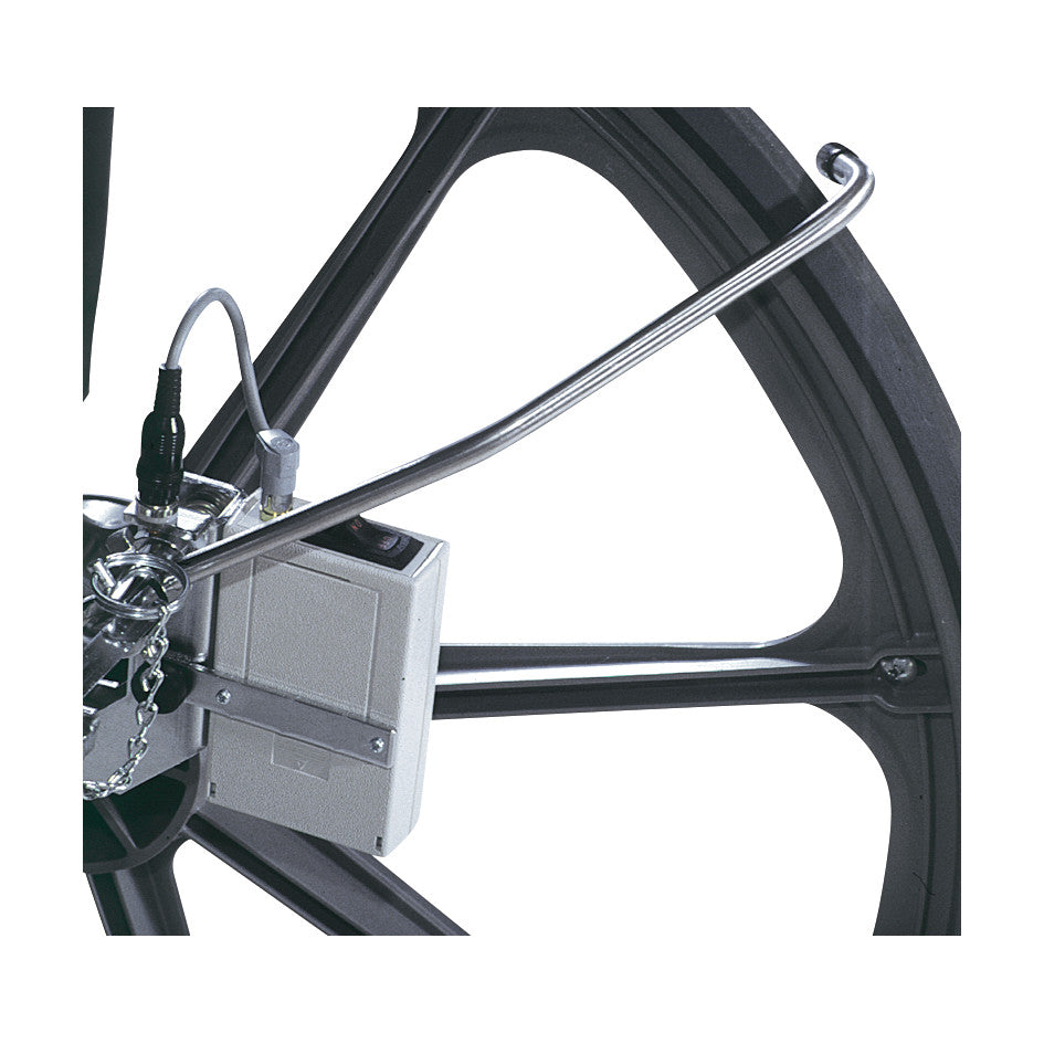 Close-up of the Safe-t Mate Anti-Rollback System attached to a wheelchair wheel, showing its mechanism and wiring.