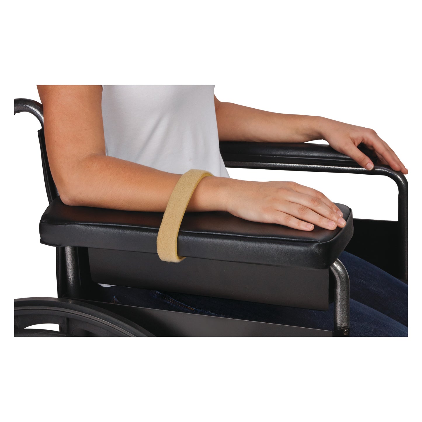 A person in a wheelchair uses an AliMed Super Beta Pile II Loop, securing their arm to the armrest with a tan loop strap.