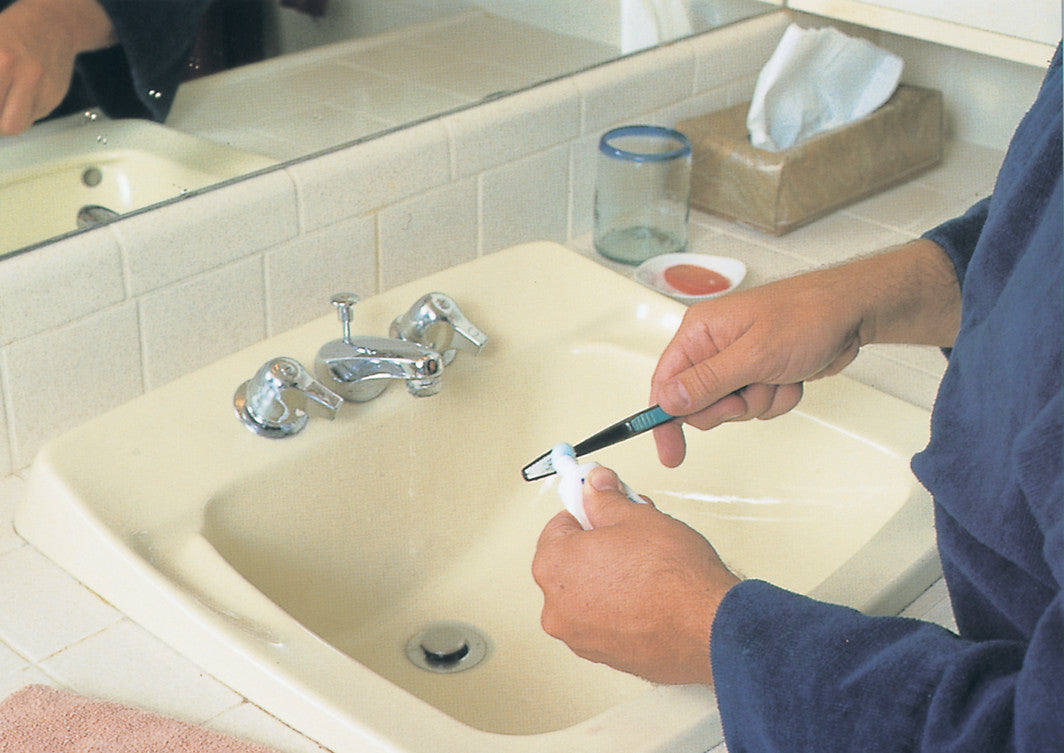A person applies toothpaste to a toothbrush over a sink. The image is from "Everyday Activities to Sequence."