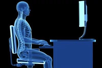 graphic of skeletal human sitting at desk