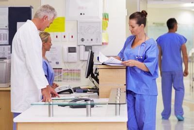 hospital worker looking at papers