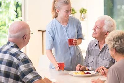 nurse giving patients juice