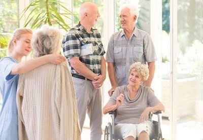 group of people talking in nursing home