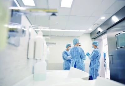 nurses in ppe gear talking