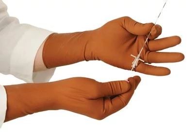 person wearing radiation protection gloves
