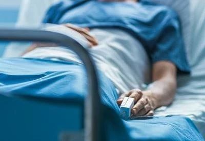 patient lying in hospital bed