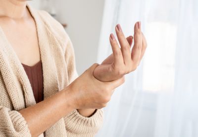 person holding their wrist