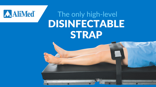 patient laying on operating room table with table strap
