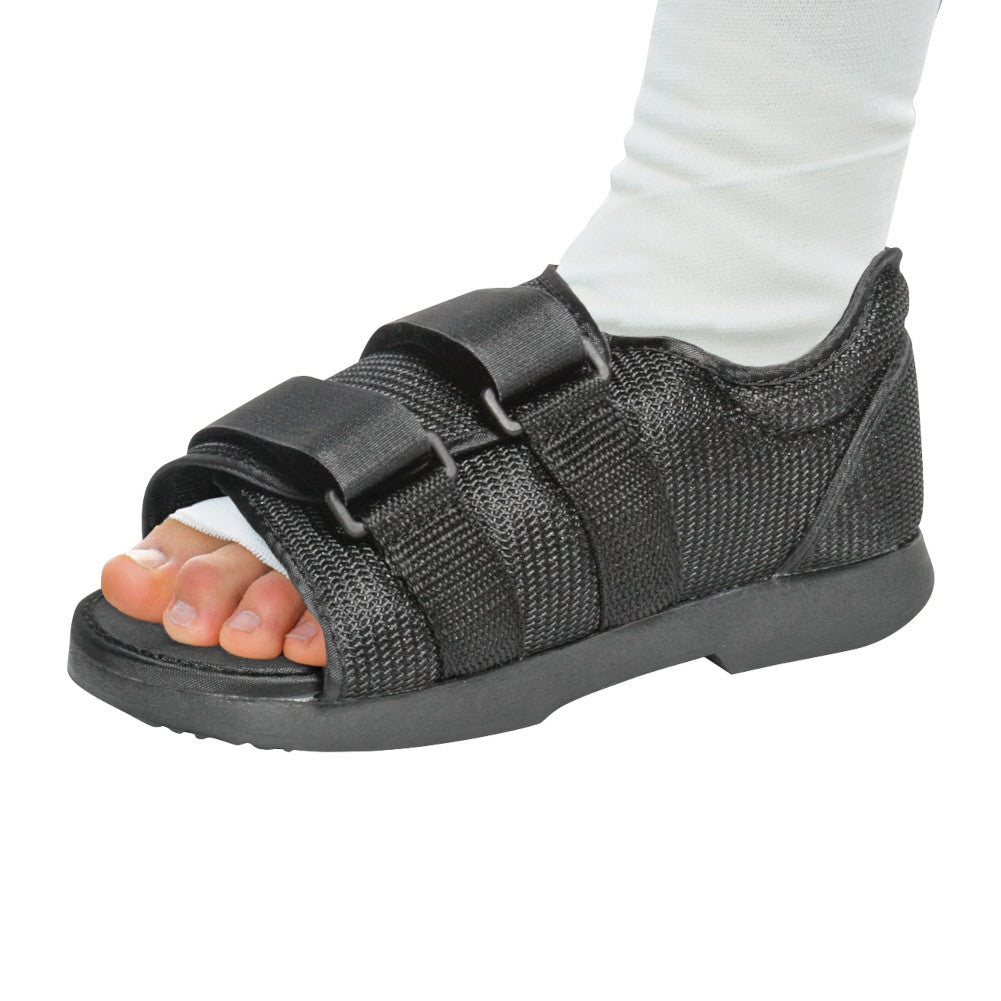 person wearing darco classic post-op shoe