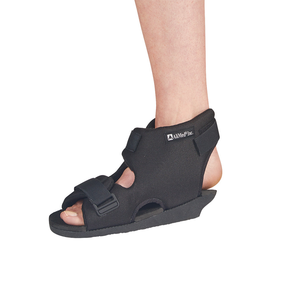 person wearing open heel orthosis