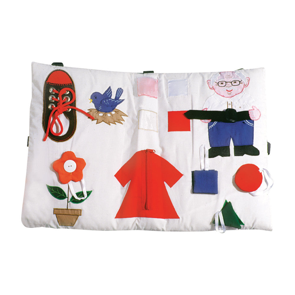 activity pillow with shoe, flower, dress, man with belt, and shapes