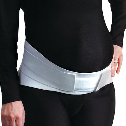 A person wears the Embrace Moderate Support Maternity Belt over a black outfit for abdominal support.