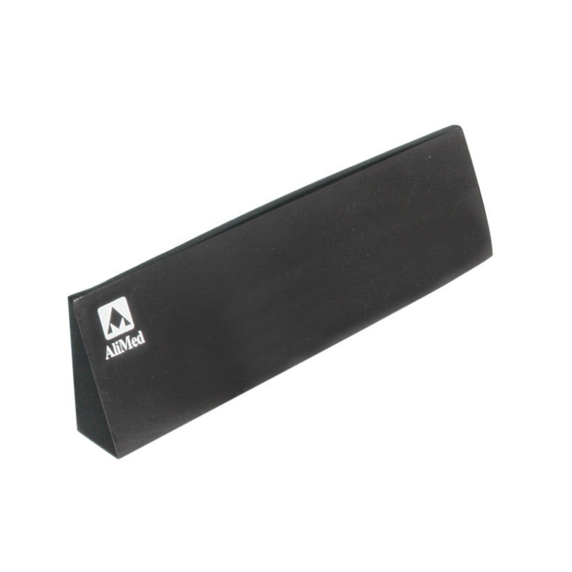 A black AliMed MRI Immobilization Positioner, triangular in shape, with a logo on the side.