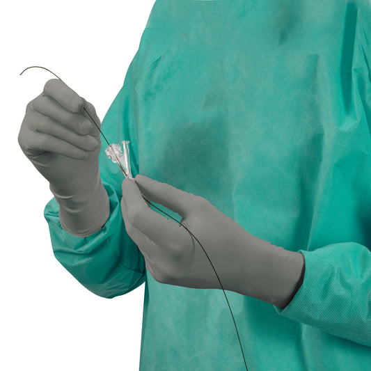 Person wearing a teal gown using AliMed AliGuard Radiation Attenuation Gloves, holding a medical wire and connector.
