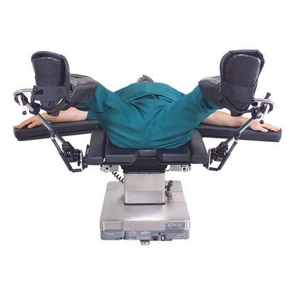 A person lies on an operating table with legs supported by Allen Ultrafin Stirrups, which are attached to adjustable metal arms.