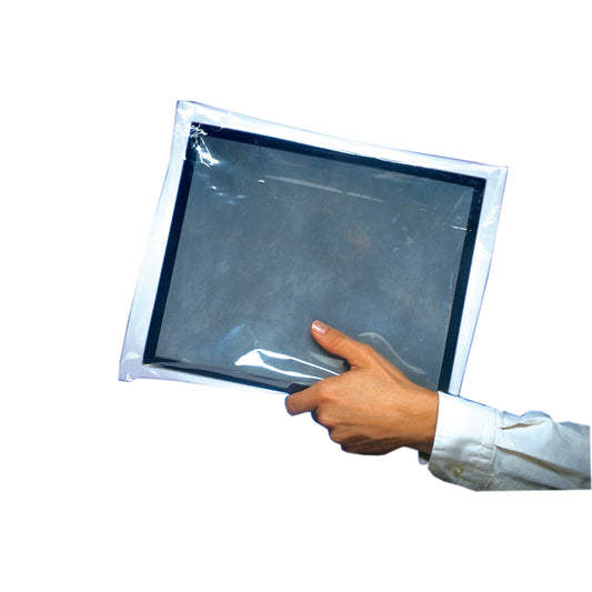 A hand holds a Protex-Ray Clear Film Disposable Cassette Cover, showing its transparent protective sleeve with a black border inside.
