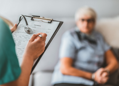 nurse taking information from patient