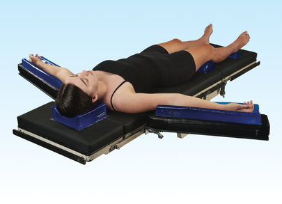 patient on operating table with aliblue patient positioners